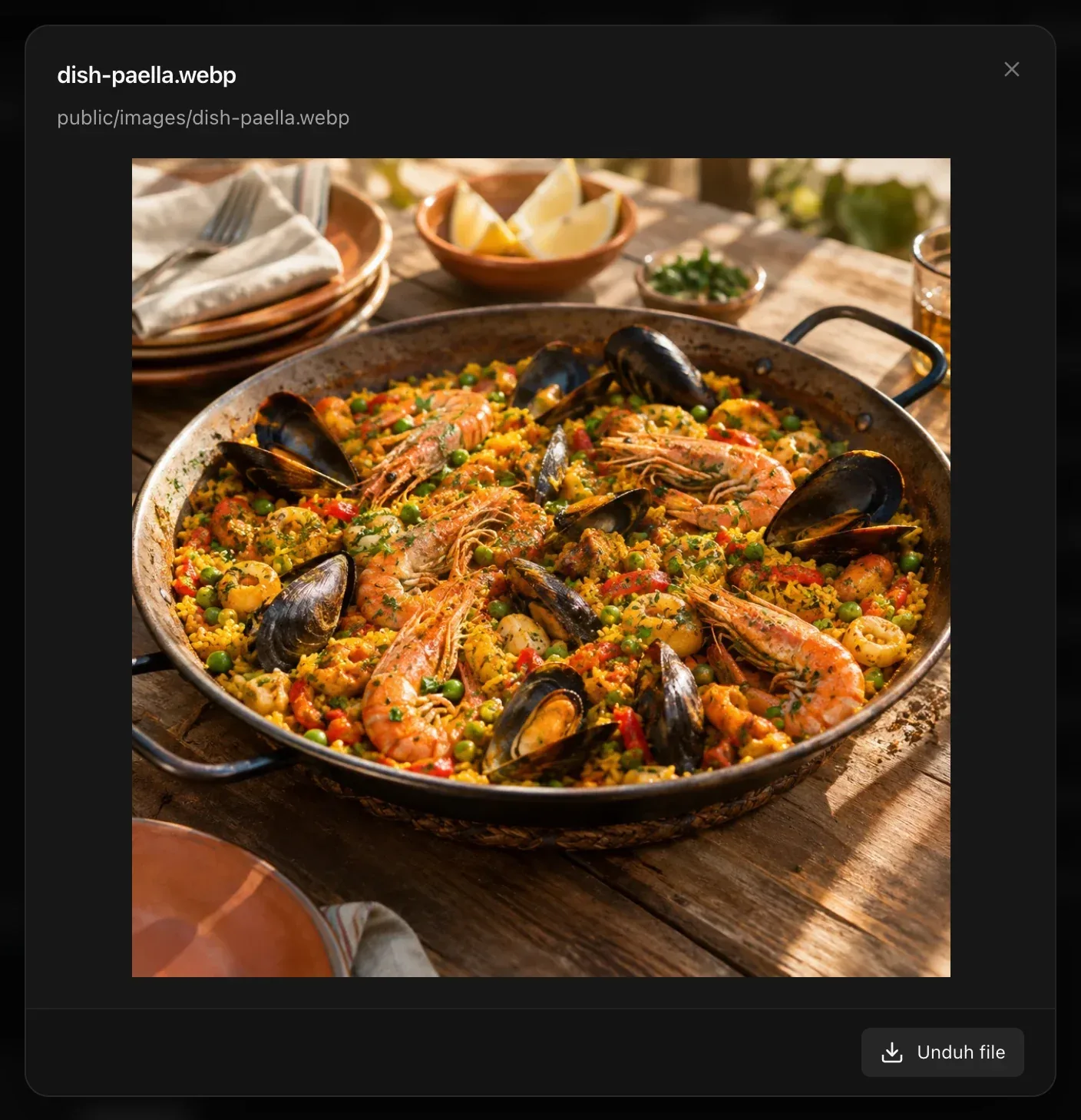 Pratinjau foto paella dish-paella.webp, dengan jalur penyimpanannya di public/images dan tombol Unduh file