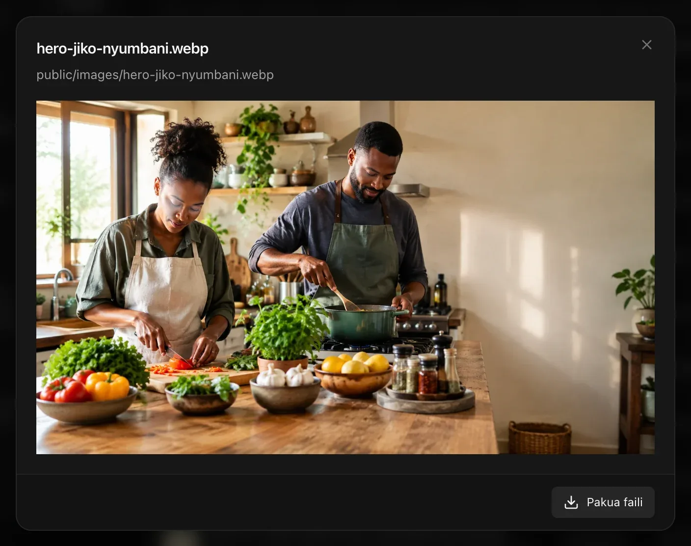 Hakikisho la hero-jiko-nyumbani.webp, picha ya wapishi wawili jikoni, pamoja na njia yake public/images/hero-jiko-nyumbani.webp na kitufe cha Pakua faili