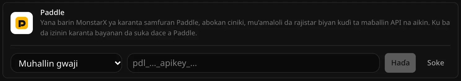 Layin Paddle a buɗe don haɗawa: menu na Muhallin gwaji ko Muhallin aiki na gaske, filin Maɓallin API na Paddle babu komai, da maɓallan Haɗa da Soke