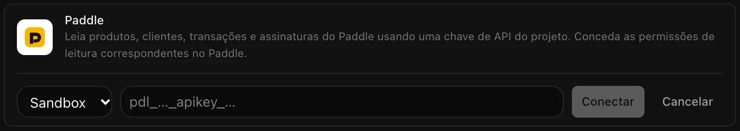 A linha do Paddle aberta para conectar: um menu de ambiente em Sandbox, o campo da chave de API vazio (pdl_…_apikey_…) e os botões Conectar e Cancelar